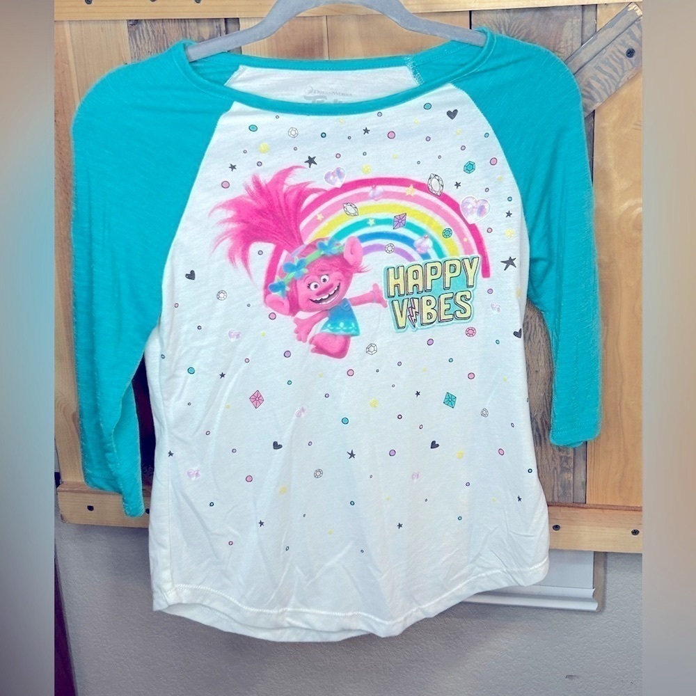 B004. Trolls “Happy Vibes” Girls white and aqua top. Large (10-12)